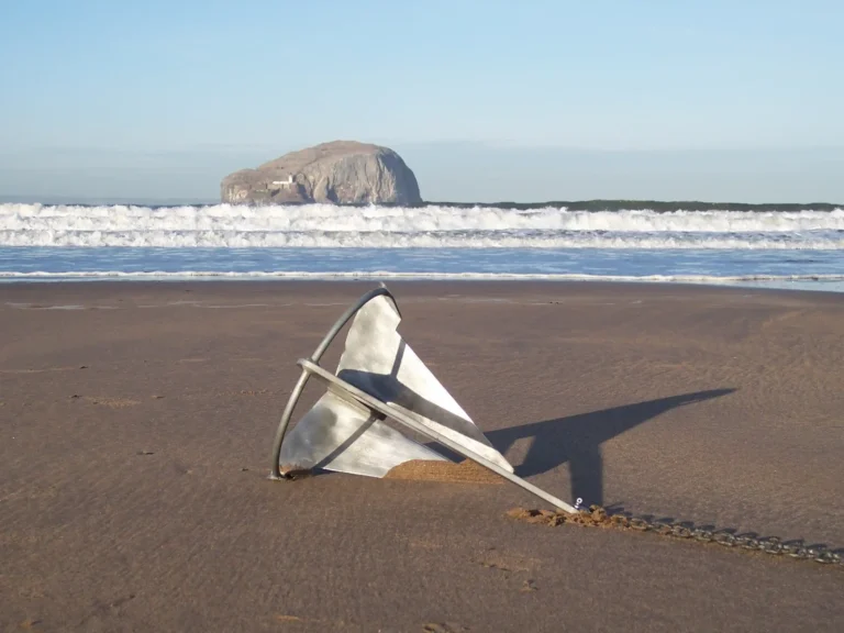 Split Fluke Designed Anchor resting on the beach
